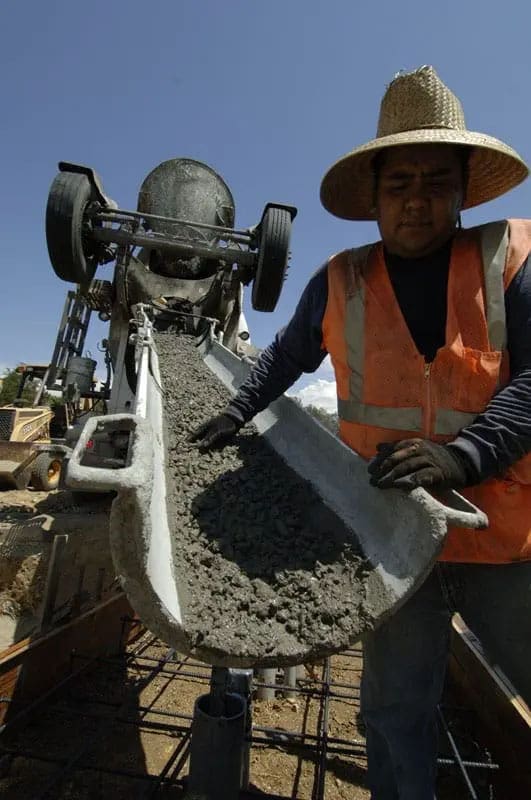 Cement truck with cement, worker construction